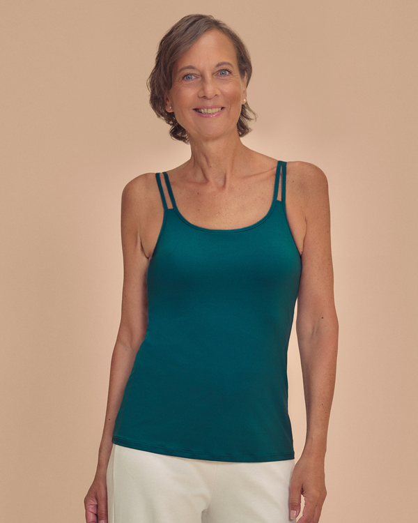 Valetta Mastectomy Pocketed Singlet top in Deep Emerald Green on a woman smiling front view
