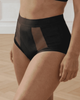 Incontinence briefs in black with sheer panels made for curvy women side view
